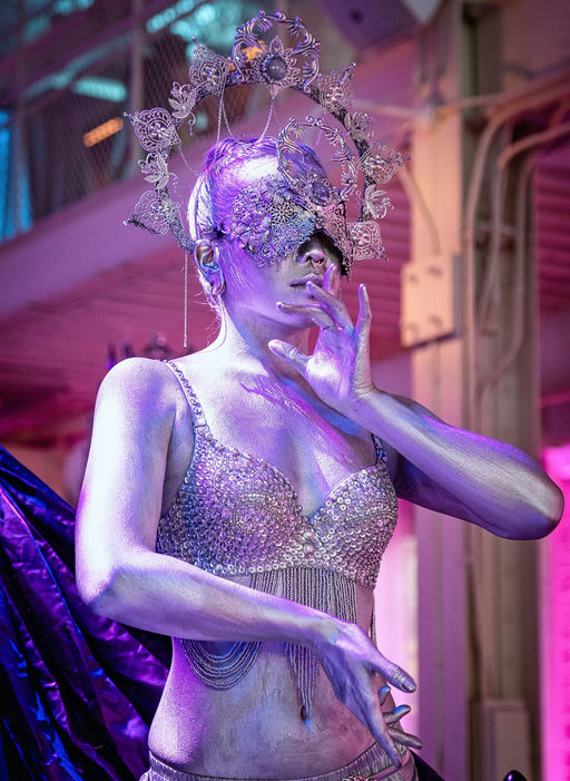 Custom welded 10-foot spiral aerial apparatus with solo performer at masquerade finale, Machine Shop Minneapolis